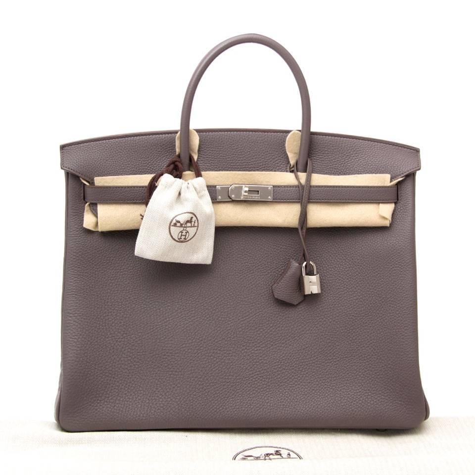 Brand new Hermès Birkin bag in timeless warm brown grey color 'Etaine' with matching silver-tone Paladium hardware. Blindstamp 'p' in a suqare, handmade in 2012. The Togo leather is soft to the touch and the fine grain gives theh bag a luxurious