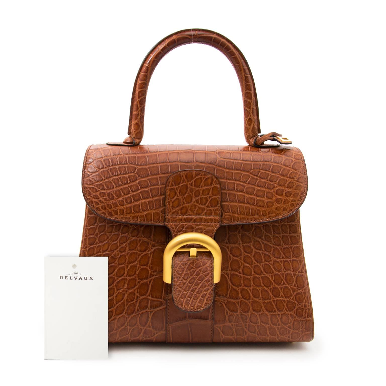 What an exceptional find : Iconic Delvaux Brillant handbag in matte crocodile hide.
The bag is in great condition, has only some minor signs of wear on the corners.
Delvaux is the oldest fine leather luxury goods House in the world.
Founded in
