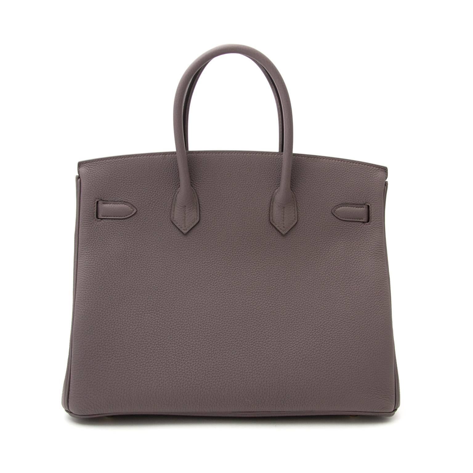 Store Fresh Hermès Birkin bag in timeless warm grey 'Etain' which contrast beautifully with the gold-tone hardware.
The Togo leather is soft to the touch and the fine grain gives theh bag a luxurious allure.
Never worn, straight from the store!