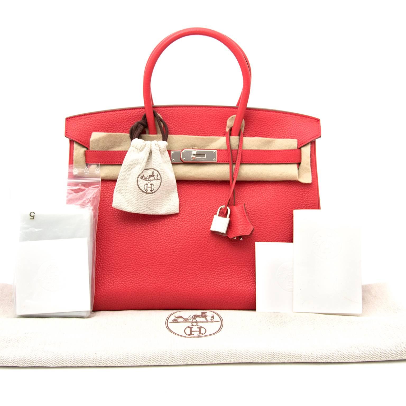 Brand New gorgeous and eyecatching Hermès Birkin bag, measuring 35 cm, handcrafted from supple Clemence Taurillon calfskin. 
Its charming and playfulcolor, named by Hermès 'Rouge Bougainvillier' , a lovely red with a touch of pinky undertone.
The
