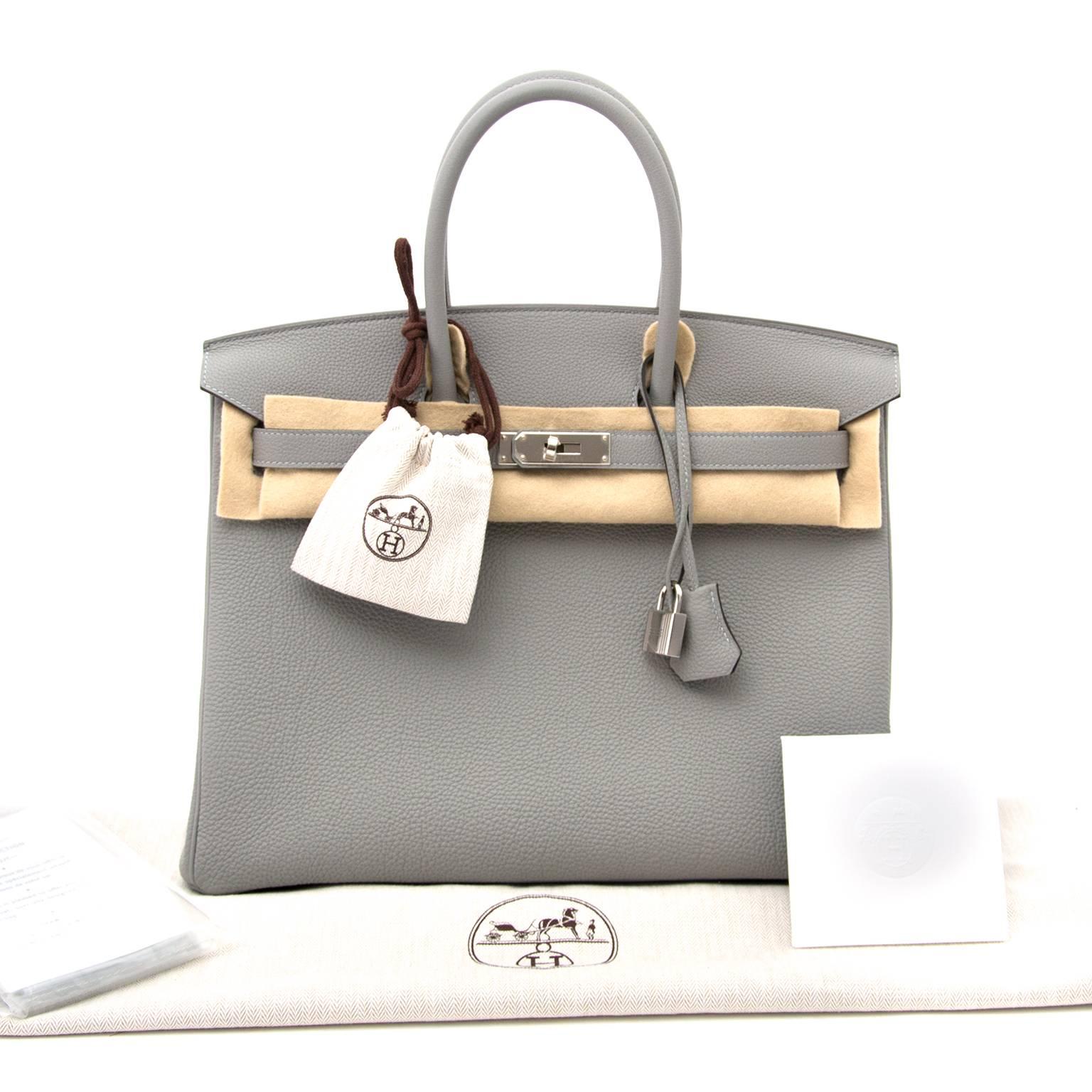 Brand New Hermes Birkin 35cm Bicolor Gris Mouette Togo And Blue Agathe

Very hard to find bi-color Birkin 35cm made out of Gris mouette Togo with Blue Agathe interior accented with silver hardware.
Gris mouette