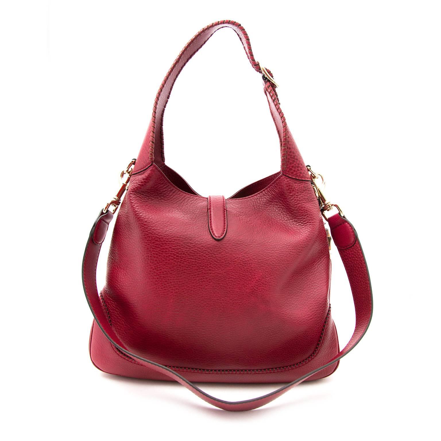 This Jackie soft hobo bag comes in a dark deep red color with gold toned hardware and bamboo details.

The interior is very spacious, comes in one large compartment with one side zip pocket and two side pockets.

The soft grained leather gives the