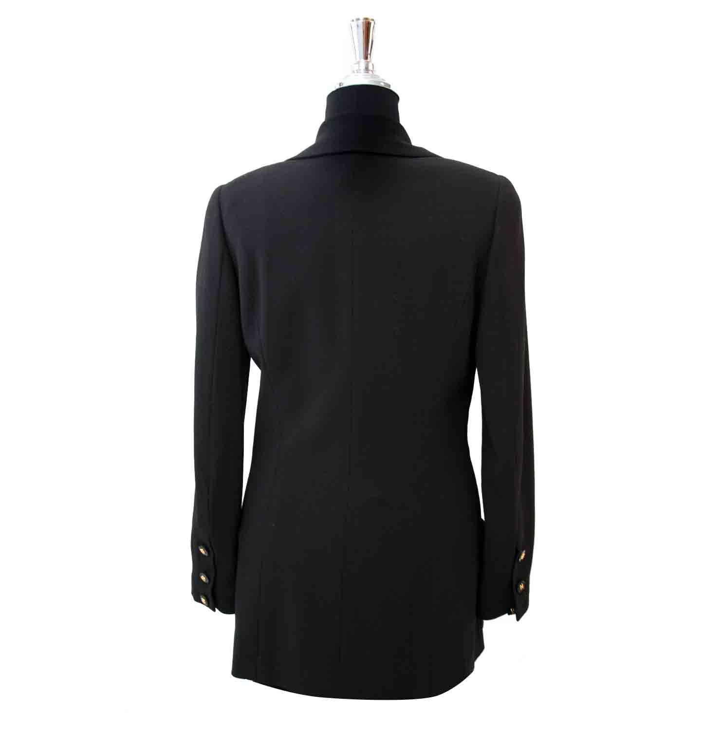 As new, excellent condition

Chanel Black Woolen Blazer - Size: 38

This classic design of Chanel is a musthave in your closet.
Crafted out of 97% Wool and 3% nylon with a silk interior lining.
The beautiful detailed gold-toned buttons are finished