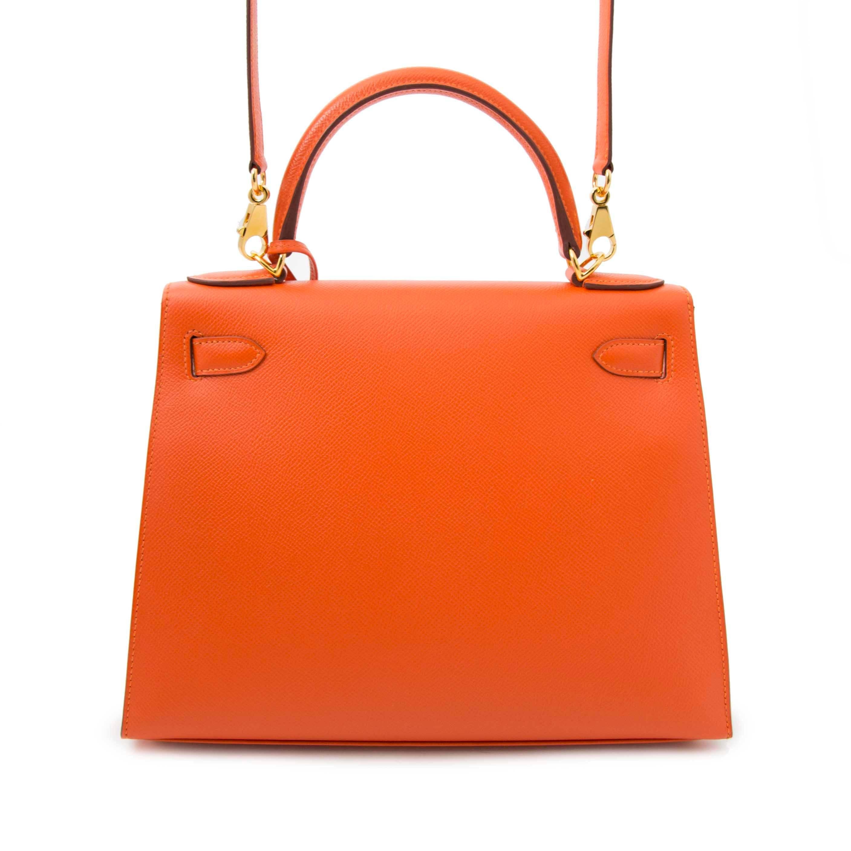 Hermes Kelly Sellier 28 Epsom Feu

Only worn once or twice Iconic Hermès Kelly 28 Epsom.
This compressed type of epsom leather holds true to its shape in all instances and is completely resilient to scratches.
This vibrant feu color, together with
