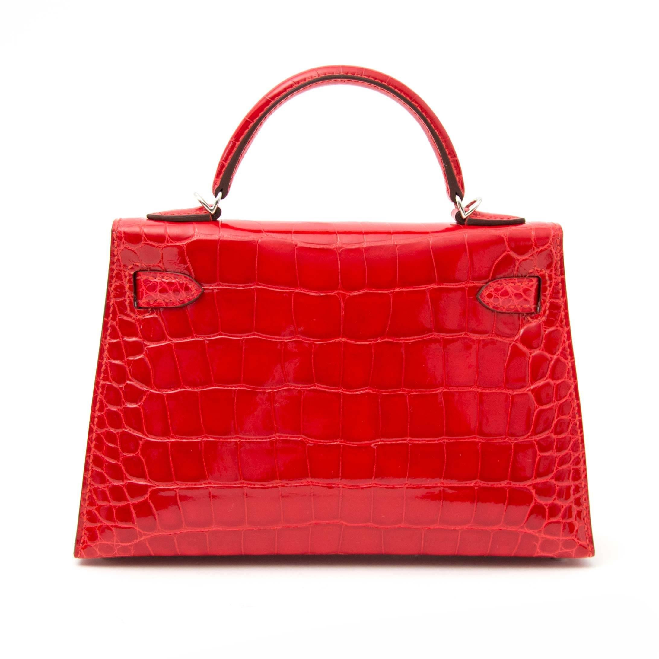 Never used

Hermes Geranium Sellier Kelly Mini 20cm Shiny Mississippiensis Alligator PHW

The talk about town Hermes Limited Edition Kelly Mini in Shiny Vibrant red toned 