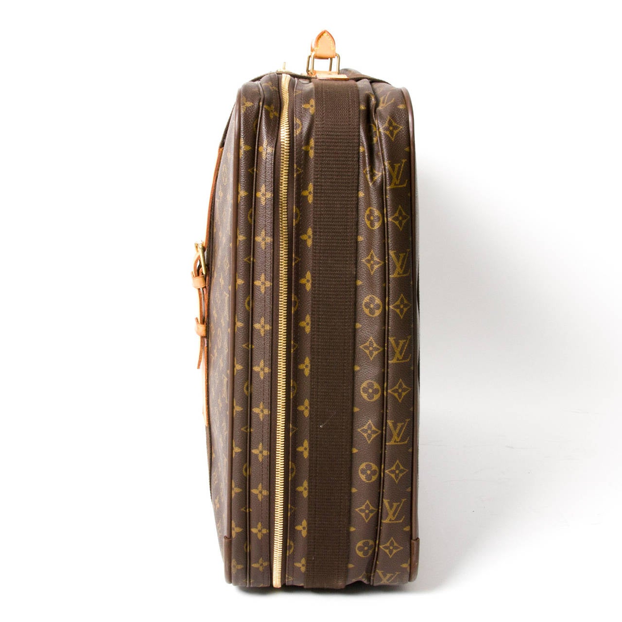 Travel in style with the brown and tan monogram 'Satellite 70' suitcase with zip closure and top handle.
Two straps with buckles on the front. One interior wall pocket and ID holder.