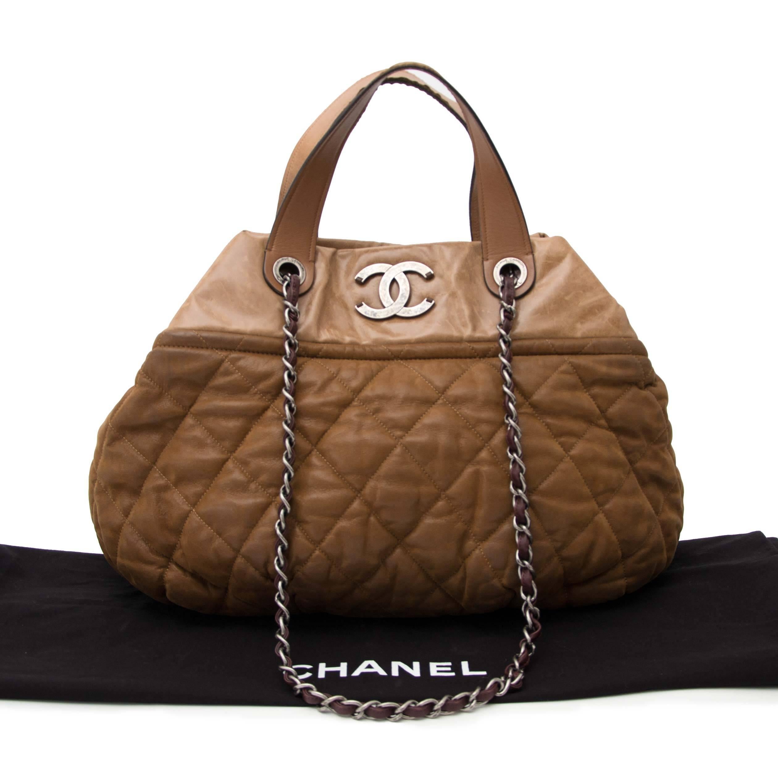 

The Chanel In The Mix was first released during Chanel's Fall 2010 collection. 

The bottom has an interesting quilted base that appears wrinkly and a sturdy leather upper half.

This purse expands at the base to become an incredibly spacious bag,