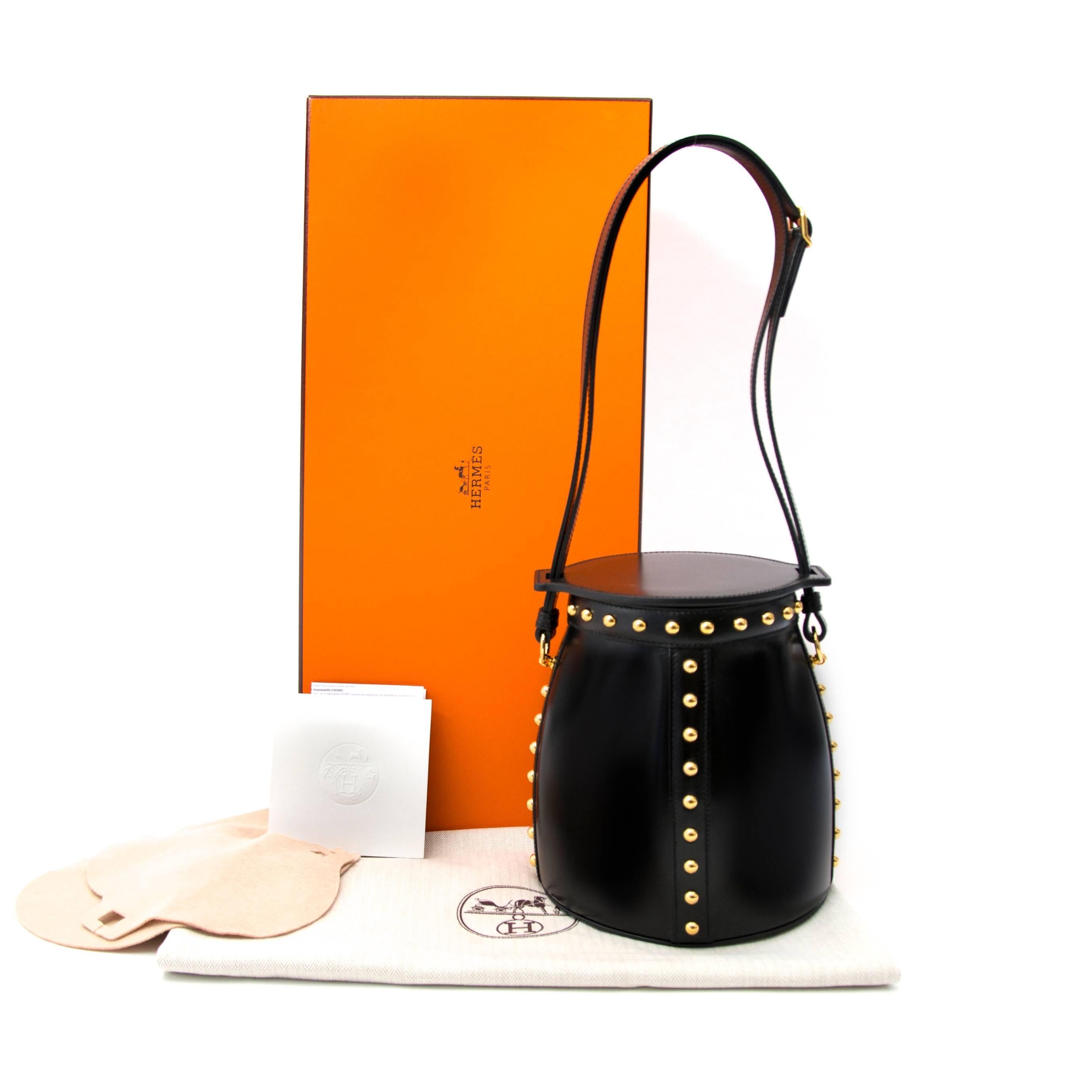 Never worn, sotre fresh

Hermès Farming Clouté Bag Box Calf Black

This Hermès Farming bag comes in black box calf leather featuring gold toned hardware. This piece a true eyecatcher with its golden studs and special design. The interior is made out
