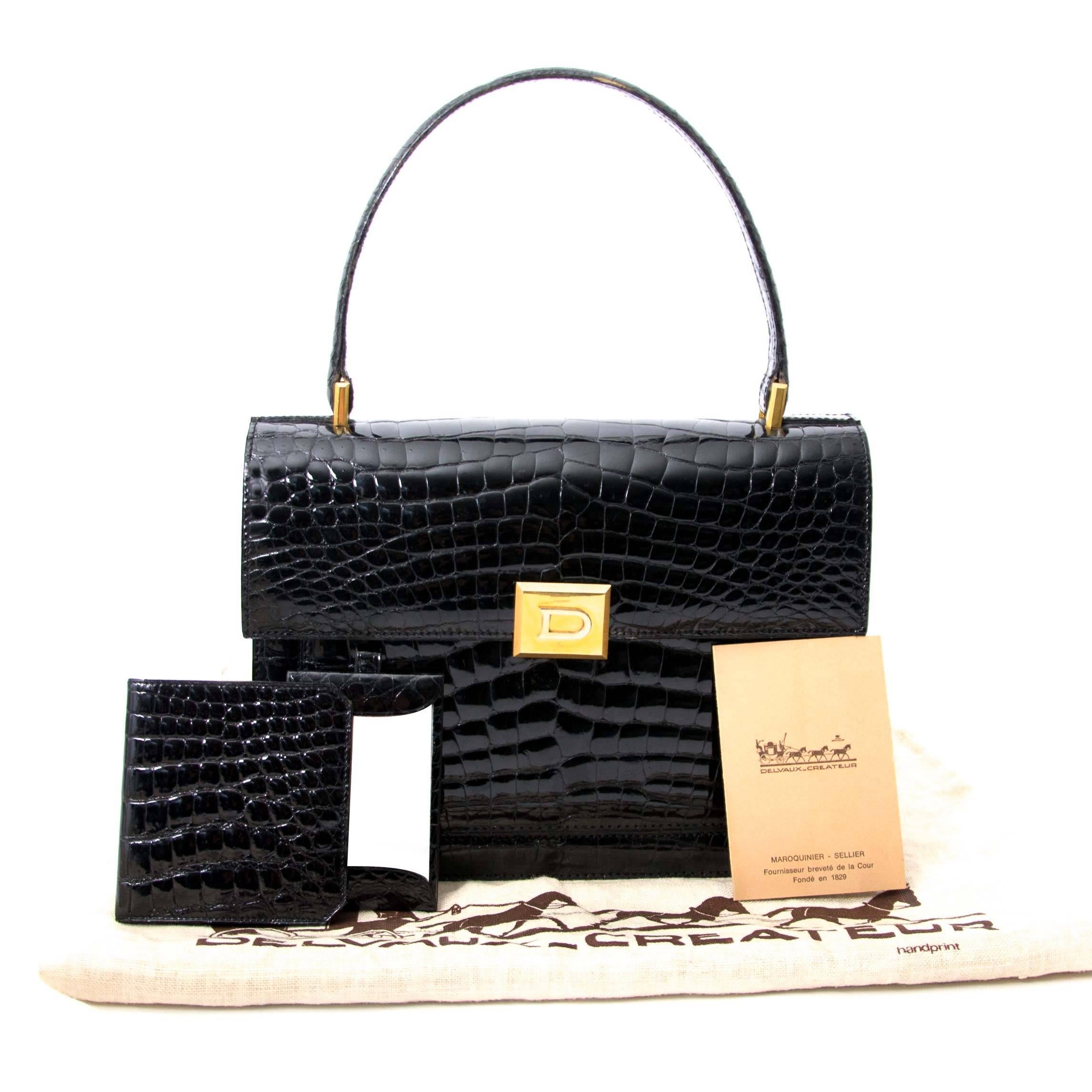 In good preloved condition.

Delvaux Black Croco Bag

Beautiful vintage Delvaux croco bag with gold-toned hardware.

The interior comes in camel suede and has a penholder, one side zip pocket and a phone pocket.

A timeless classic beauty.

Comes