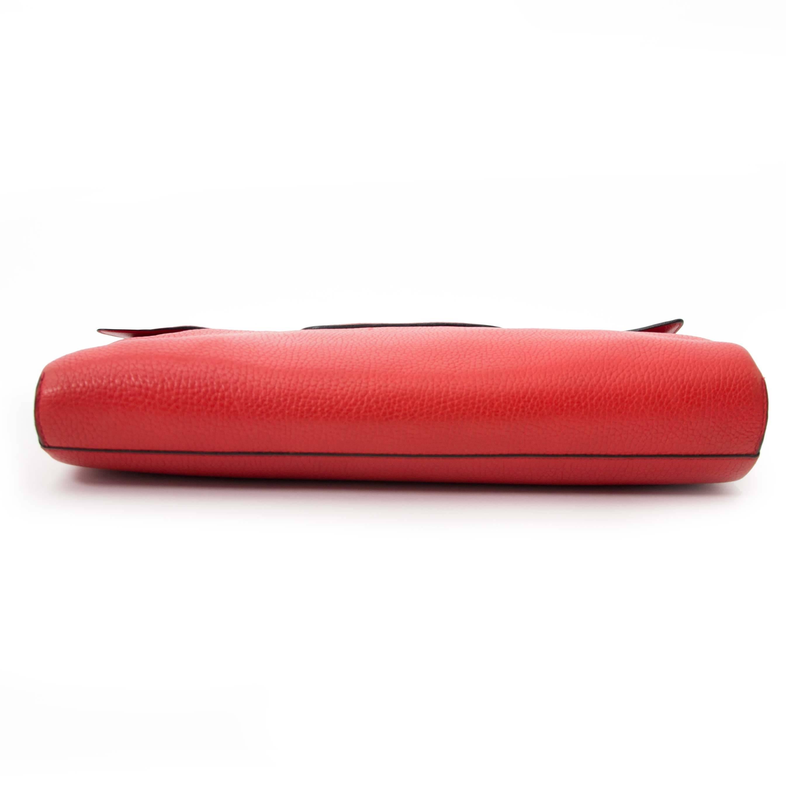 

Lovely clutch by Delvaux in coral red grained leather. Wear it as a evening clutch to take your phone, wallet, lipstick with you or use it to work to to store your personal documents.

The vibrant red color is a fabulous addition to everyone's