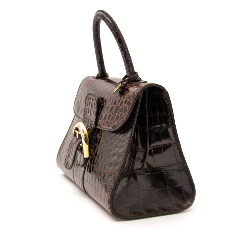 Estimated retail price: €25000

Delvaux Brillant PM Crocodile Brown GHW

This exquisite crafted Delvaux Brillant comes in a brown croco leather featuring gold toned hardware.
This timeless beauty comes with the iconic Delvaux mirror.
The interior is
