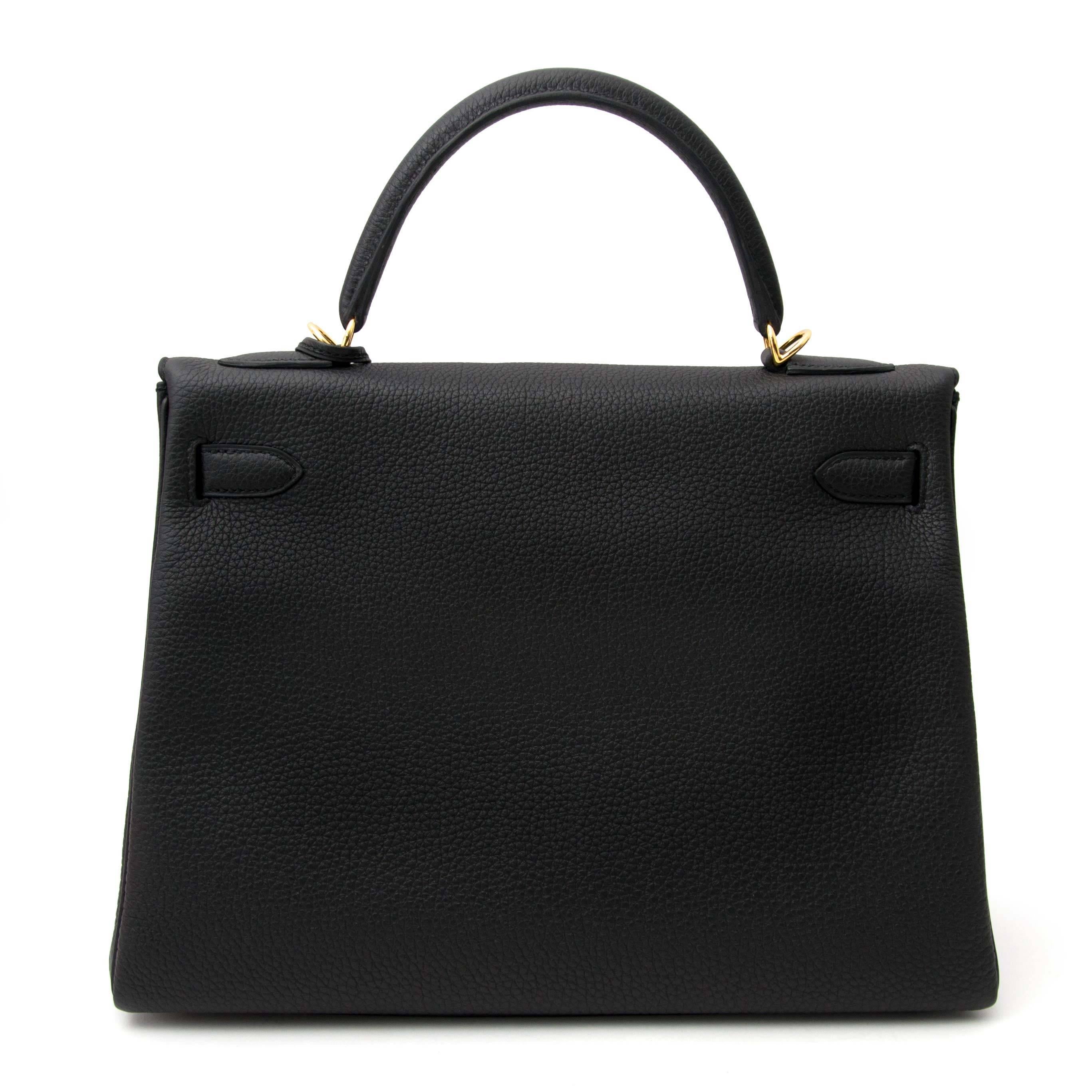 Never Used Hermes Black Kelly Togo 32cm GHW. 
This Hermes Kelly in timeless black is a real statement piece.
This Kelly bag is made of smooth Togo leather.
Togo leather is an incredibly popular leather for one simple reason: it is almost entirely