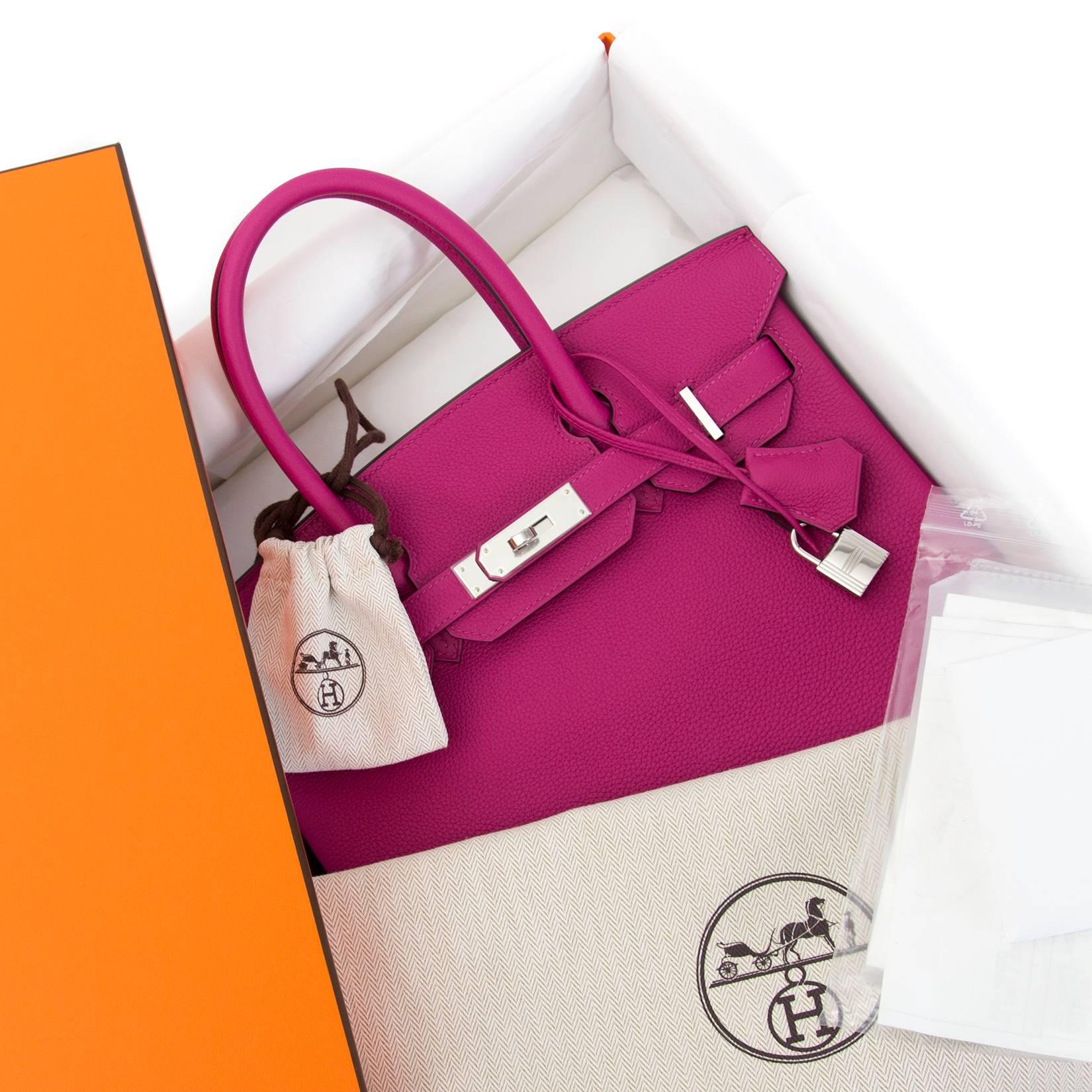 The height of luxury: this Hermès Birkin 30 comes in precious togo, which is the most coveted leather type. The Rose Pourpre is a precious color, balancing between hot pink and warm purple. This is sure to be a showstopper!

Comes with full set:
-