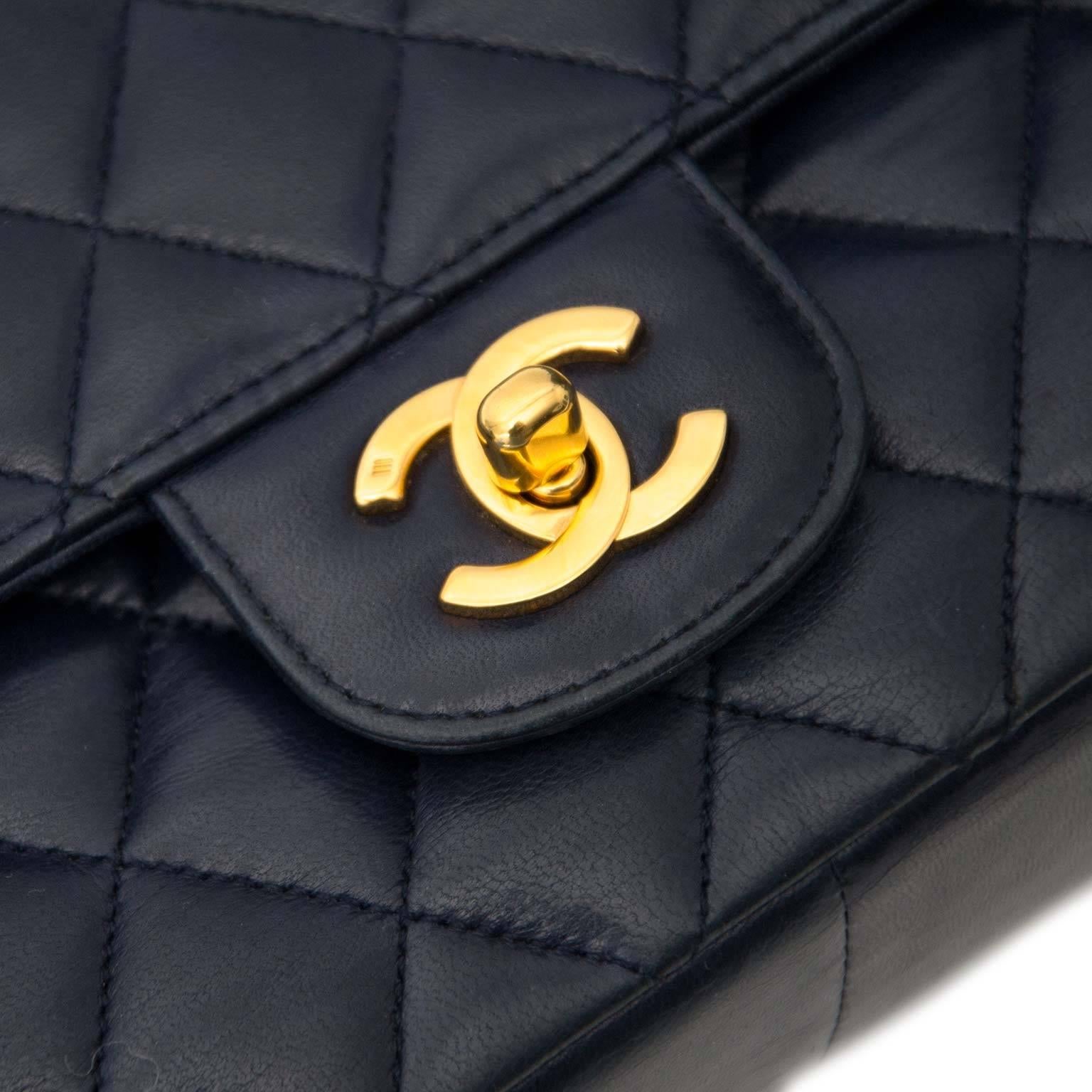 Good preowned condition

Chanel Vintage Blue Leather Classic Flap Bag

Smooth calfskin leather flap bag by Chanel. This vintage beauty stems from the early 90's and features gorgeous gold toned hardware.

The CC turn lock on the front opens into a