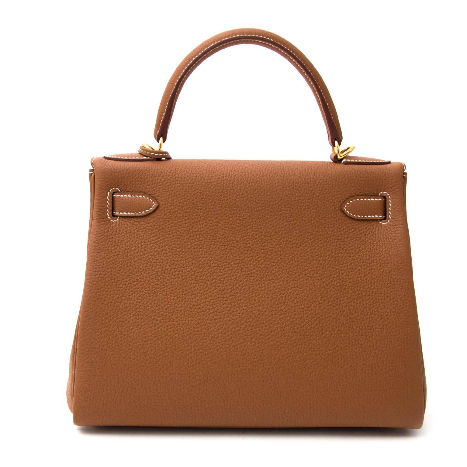 Never Used!

Hermès Kelly 28 Togo Gold GHW

This Hermès Kelly in timeless gold is a real statement piece.

The Kelly bag is made out of togo leather which is almost entirely scratch resistant and its grainy smooth texture is very nice.

The gold