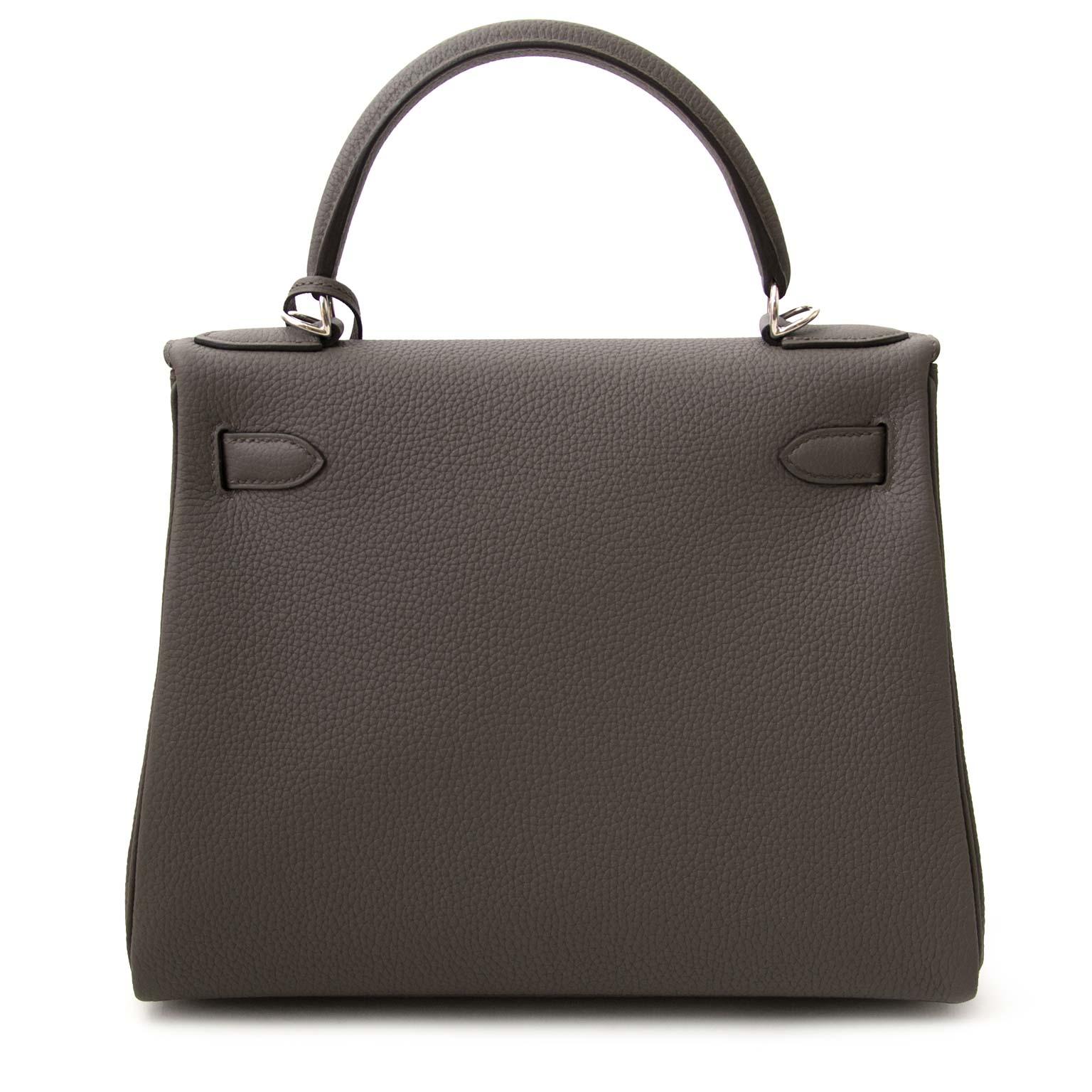 Never Used!

Never Used Hermes Kelly 28 Togo Etain 

This Hermès Kelly in timeless etain is a real statement piece.

The Kelly bag is made out of togo leather which is almost entirely scratch resistant and its grainy smooth texture is very