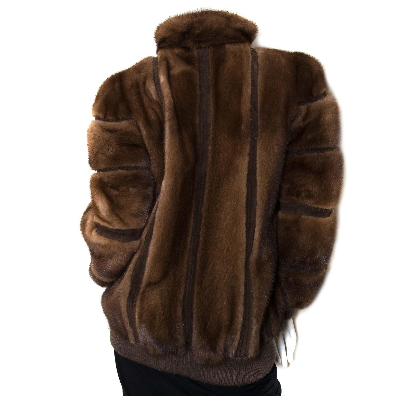 This stunning Christian Dior Mink Fur Bomber Jacket is a true must-have.
Circa 1980. The item features a stand-up collar, long bubble sleeves, ribbed wool hem and cuffs and a zipper closure. 
