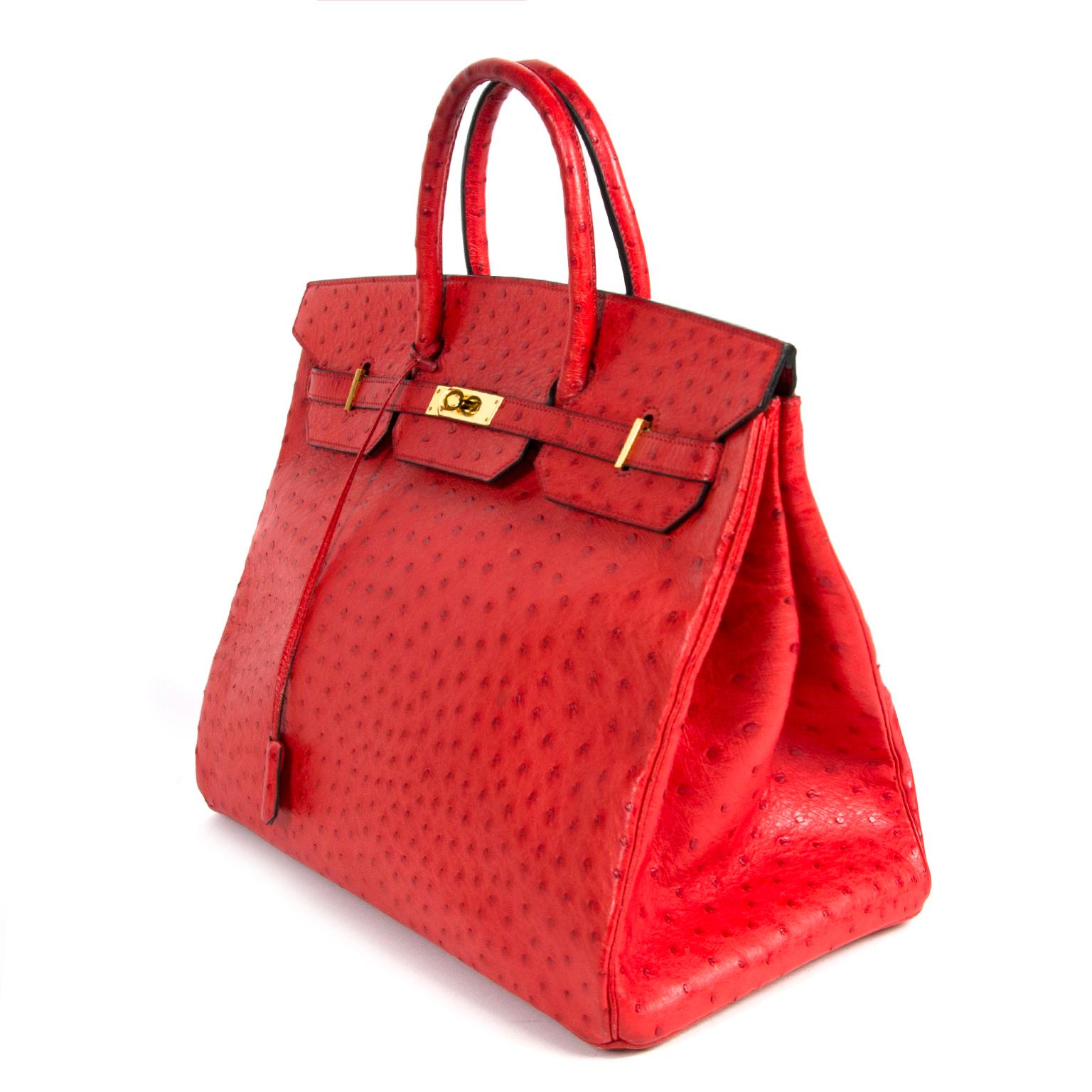 Hermès Birkin 40 Ostrich Bougainvillea PHW/ This absolutely fabulous bag is made from ostrich leather. Made with extreme craftmanship. This Hermès Birkin bag is a beautiful piece with a deep Bougainvillea red color. The bag features gold toned