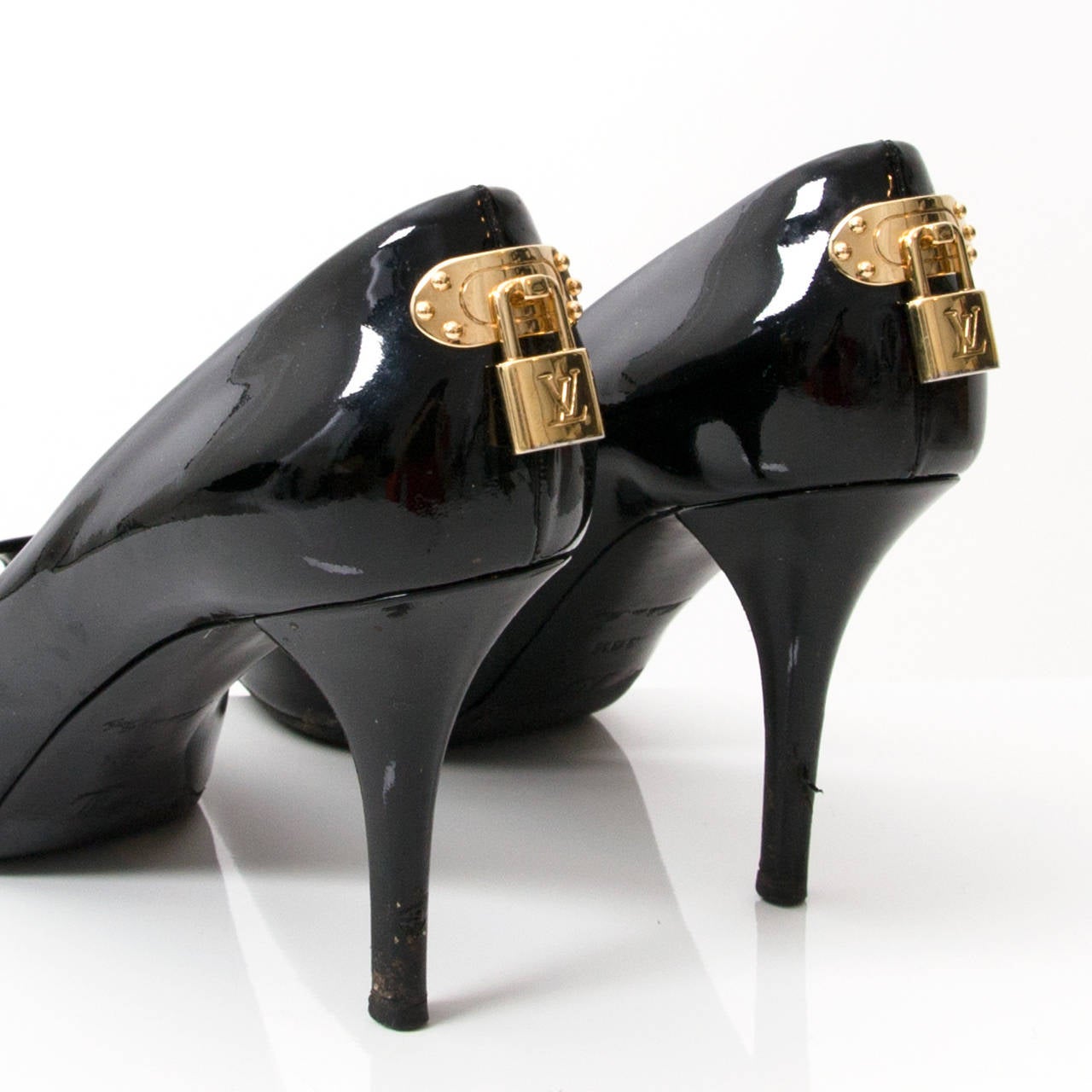 Black patent leather pumps with peep-toe.

The shoes feature a gold faux lock on the heels.

The 'Oh Really! pumps have been spotted on various celebrities.