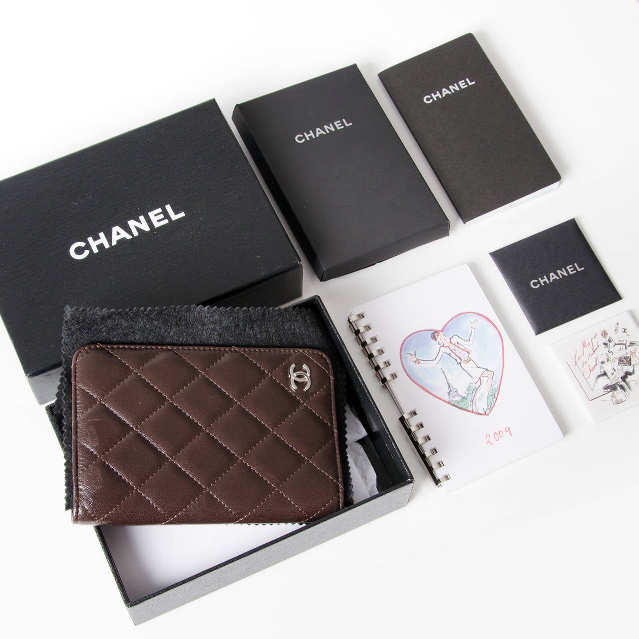 Organise your life in the most stylish way possible with this quilted lambskin leather agenda by Chanel.

Brown lambskin leather on the outside and inside. Silver hardware logo on the bottom right corner.

Comes with everything; authenticity