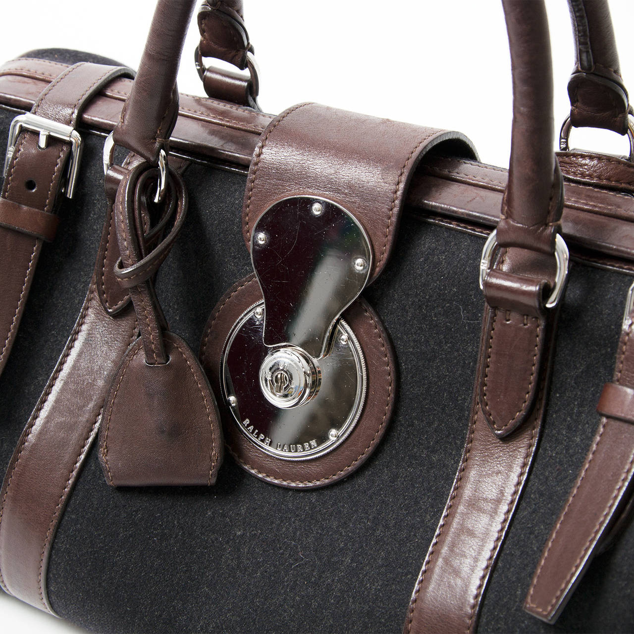 This Ralph Lauren doctor's purse is a structured top handle bag with anthracite textile body and dark brown trim. Silver-tone hardware.