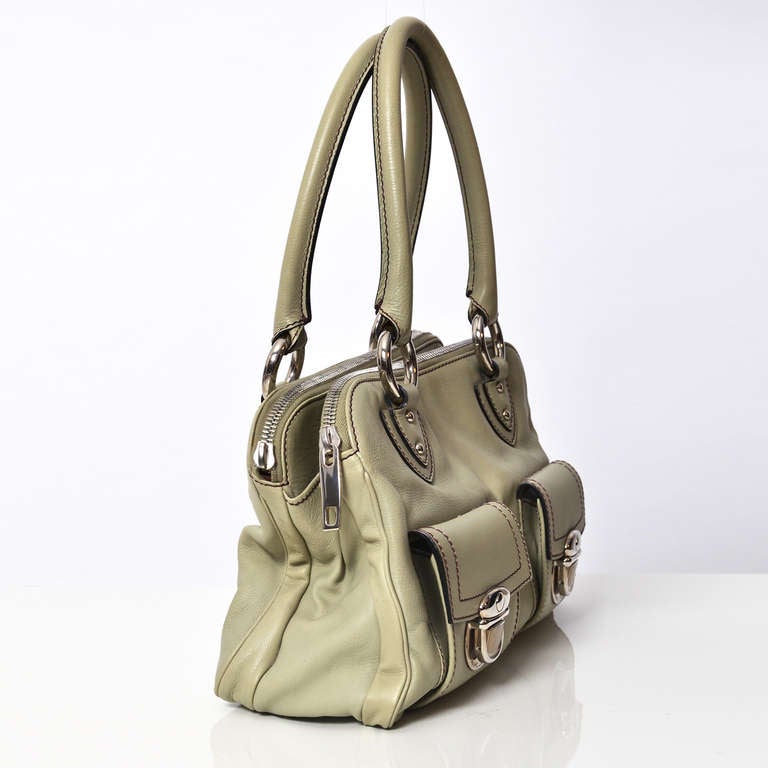 Marc Jacobs olive green leather shoulder bag with two front pockets. Includes four studs at the bottom for protection. Silver hardware. Comes with the original dust bag.