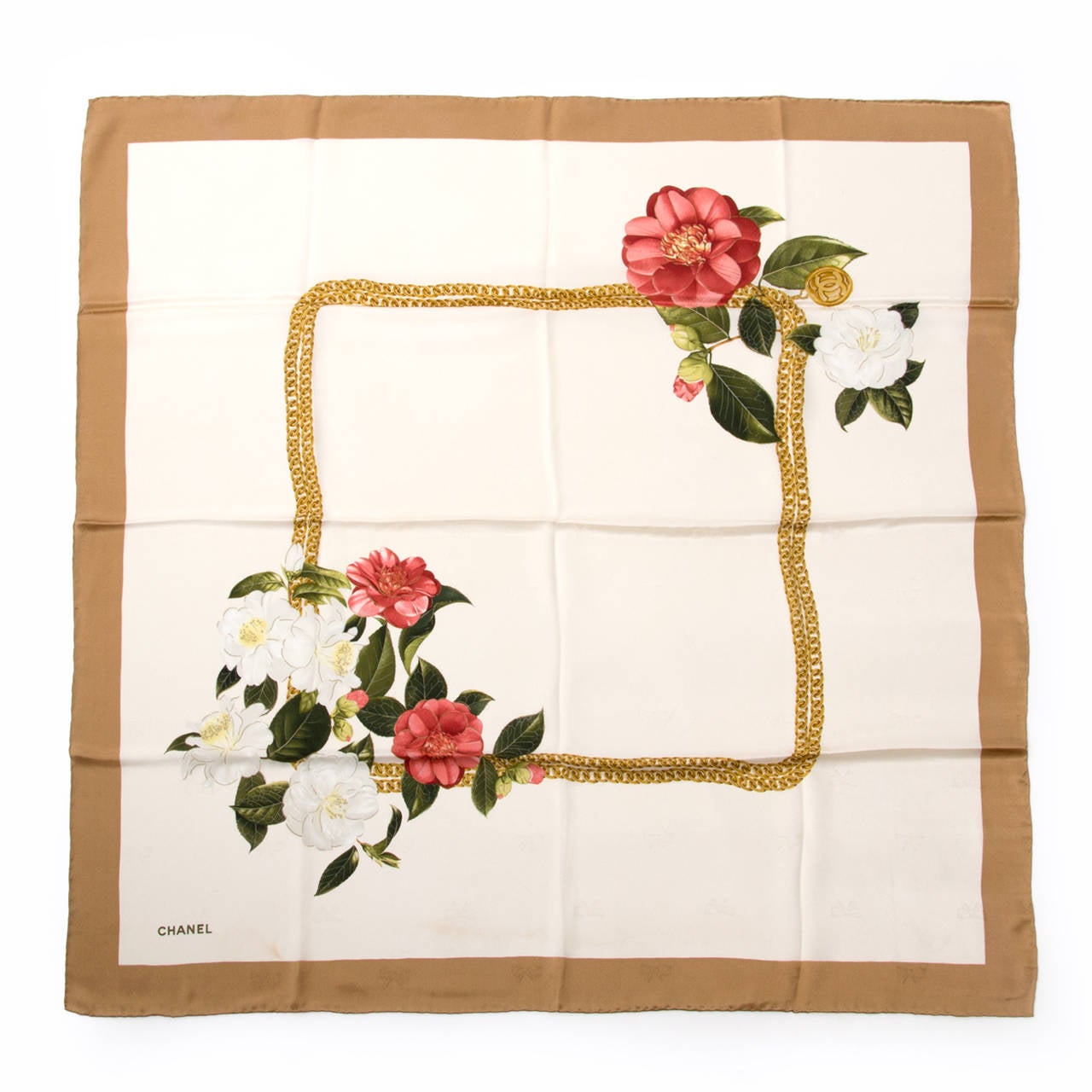 This beautiful scarf from Chanel is made out of 100% silk and has a marvelous floral print in cream, shades of rose, gold and green.