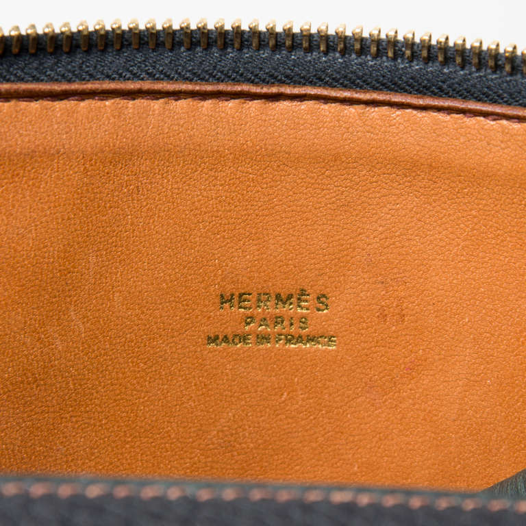 Hermès navy blue Bolide handbag with removable strap. Gold hardware throughout. Contrast stitching. Gold 