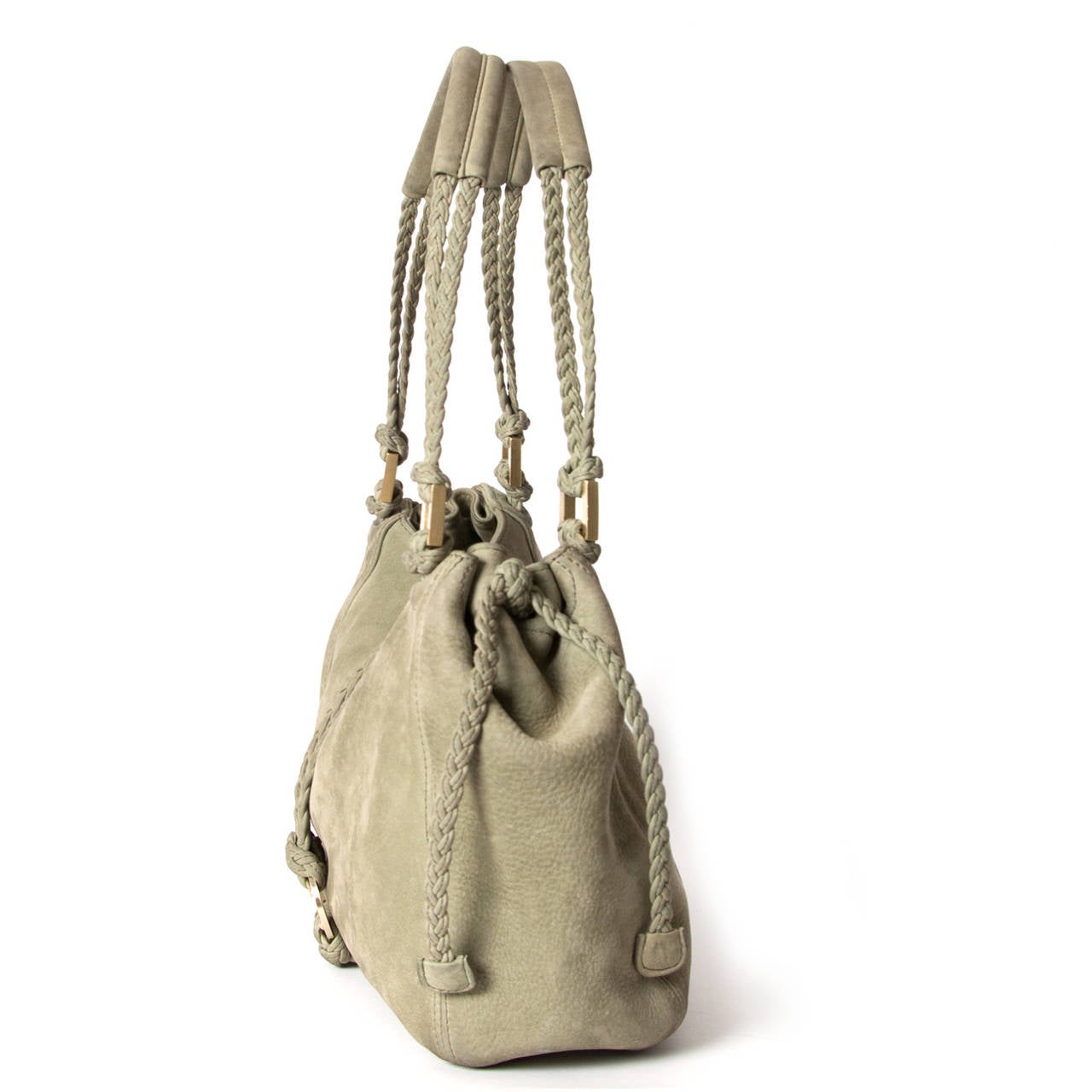 Delvaux Woven Shoulder Bag in Soft Green

Beautiful shoulder bag by Belgian house Delvaux in a soft green suede leather.

Featuring decorative braided details and gold 