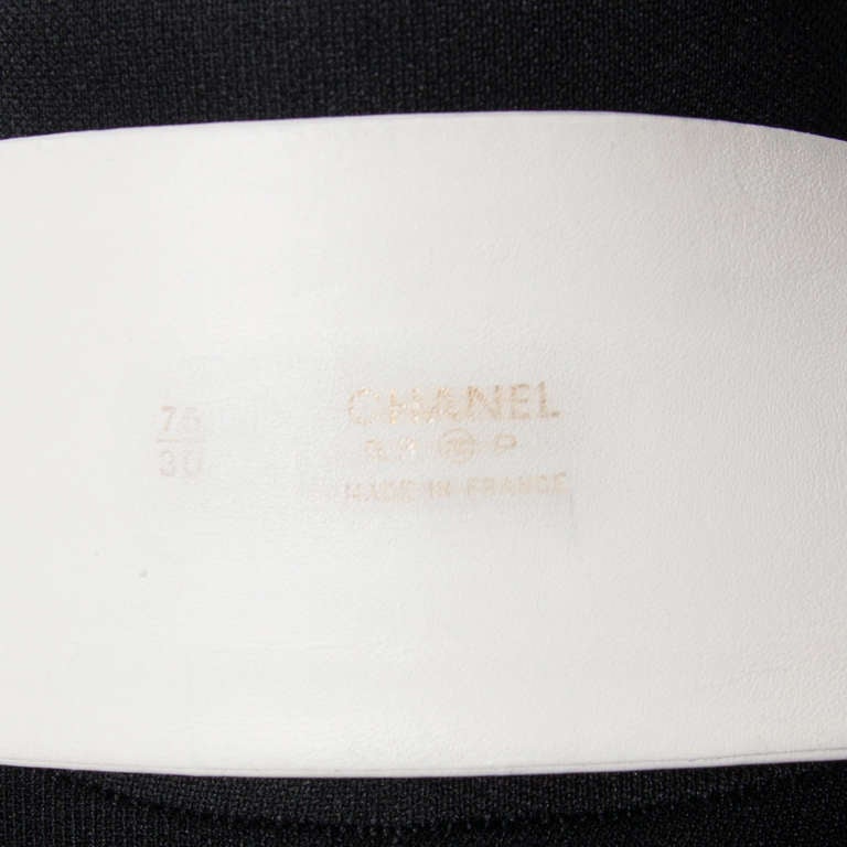 Chanel white leather waist belt with CHANEL letter charms. Gold tone 