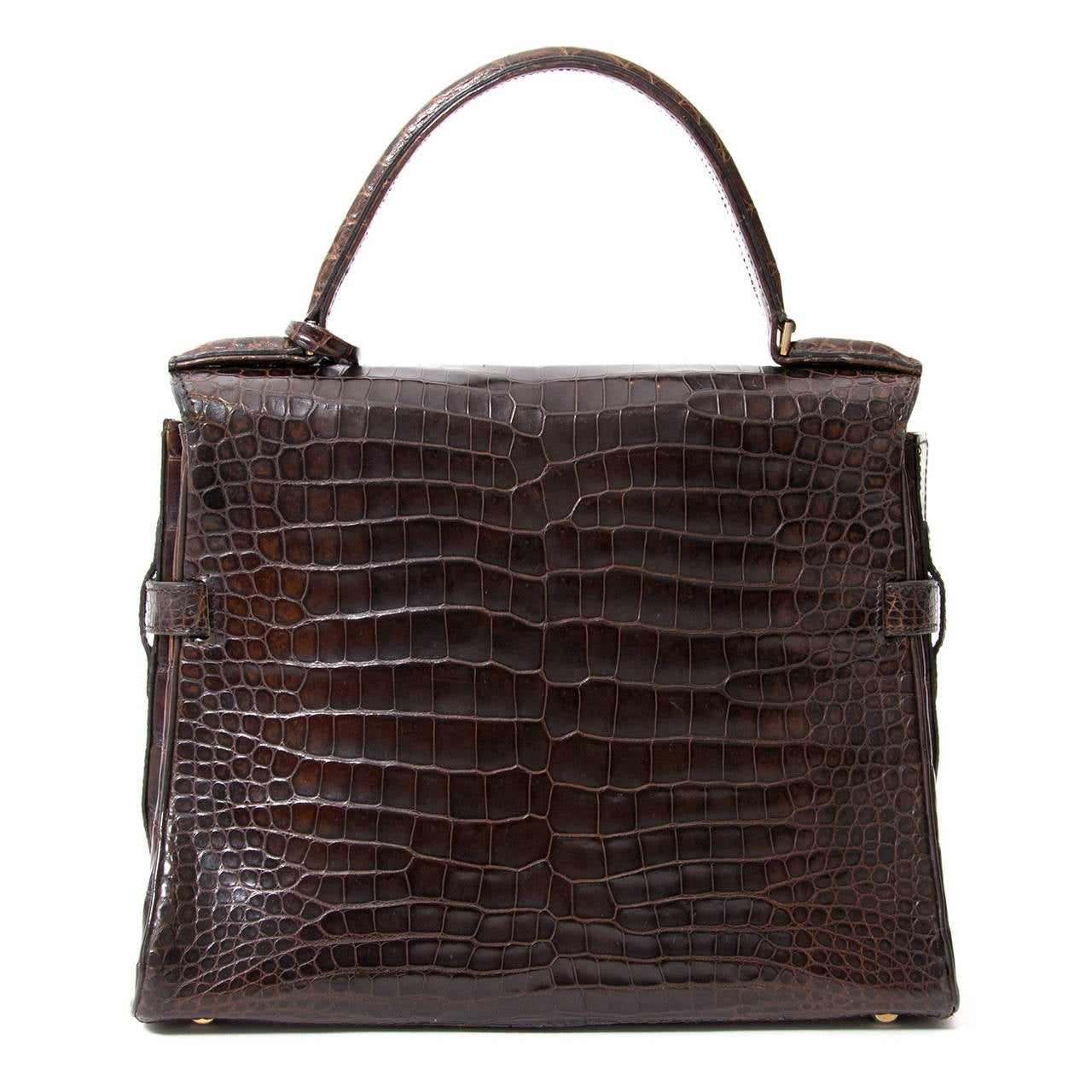 Vintage Delvaux Tempête in beautiful dark brown crocodile leather. With its statement hardware and geometric shape, this beauty is one of Delvaux's most architectural bags. Handcrafted out of the finest crocodile leather , this Tempete crocodile