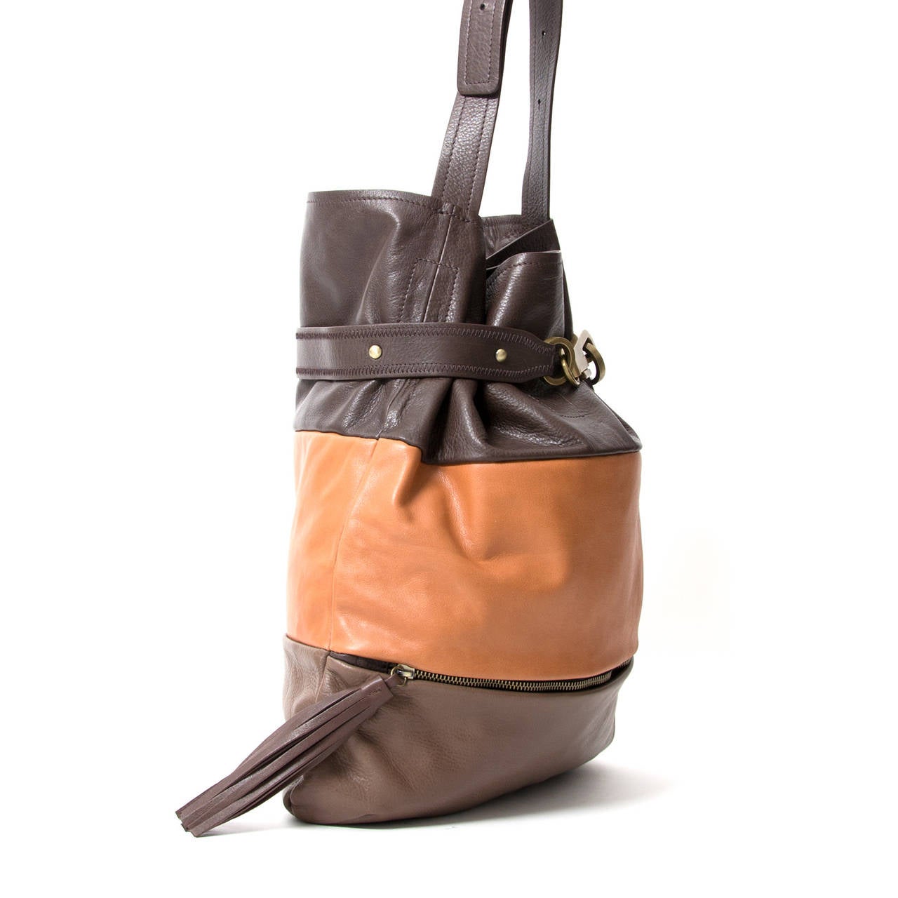 Trendy Chloe Joan Bucket Bag. It is made from a stunning combination of dark brown, light brown, and orange soft lambskin with brushed brass hardware.