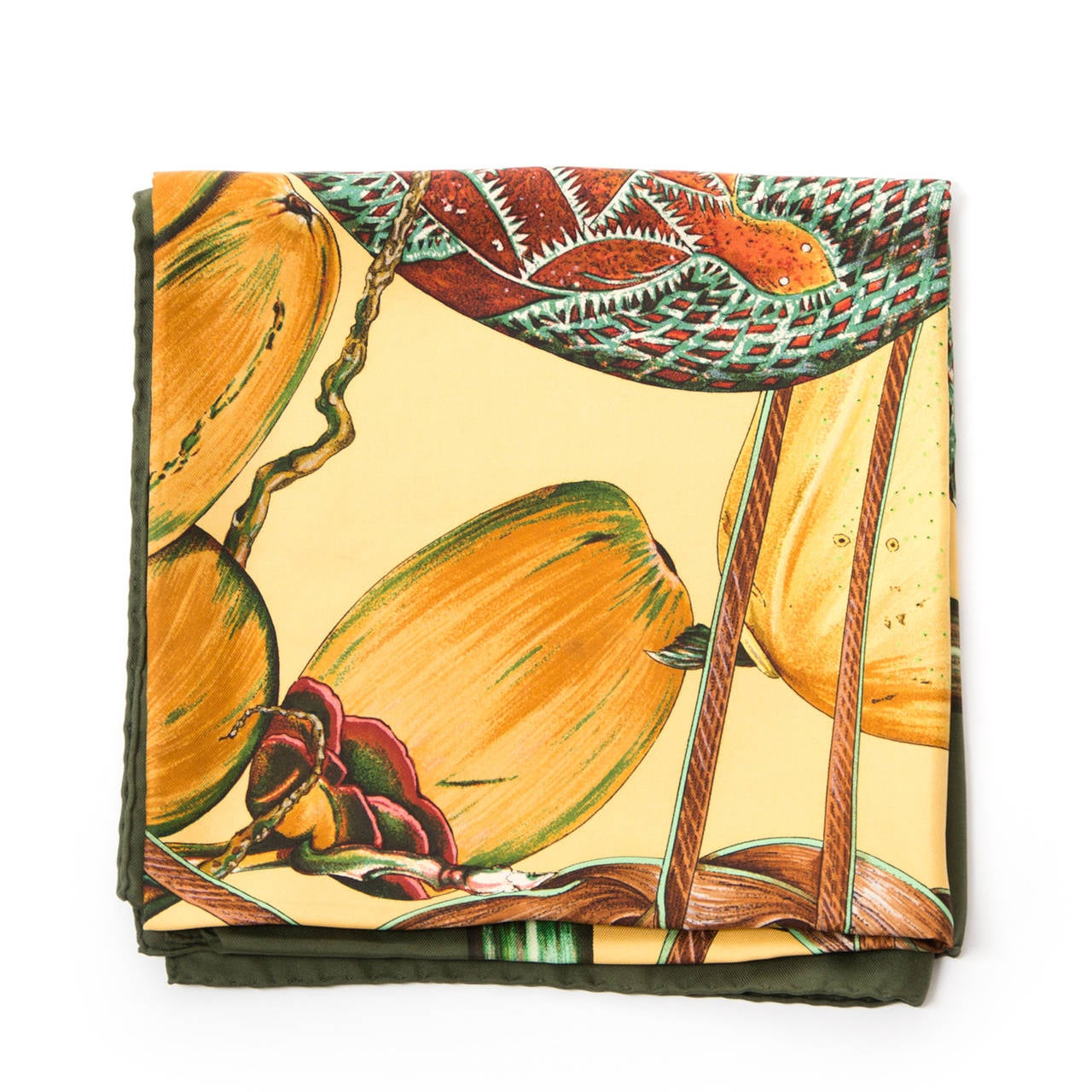 Dark green Jardin Créole scarf in autumn colours. This scarf is 100% silk and features créole fruits.