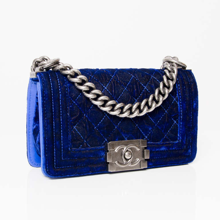 Chanel Boy Flap Bag. 
Electric blue velvet and gunmetal aged silver hardware. 
Double C closure.