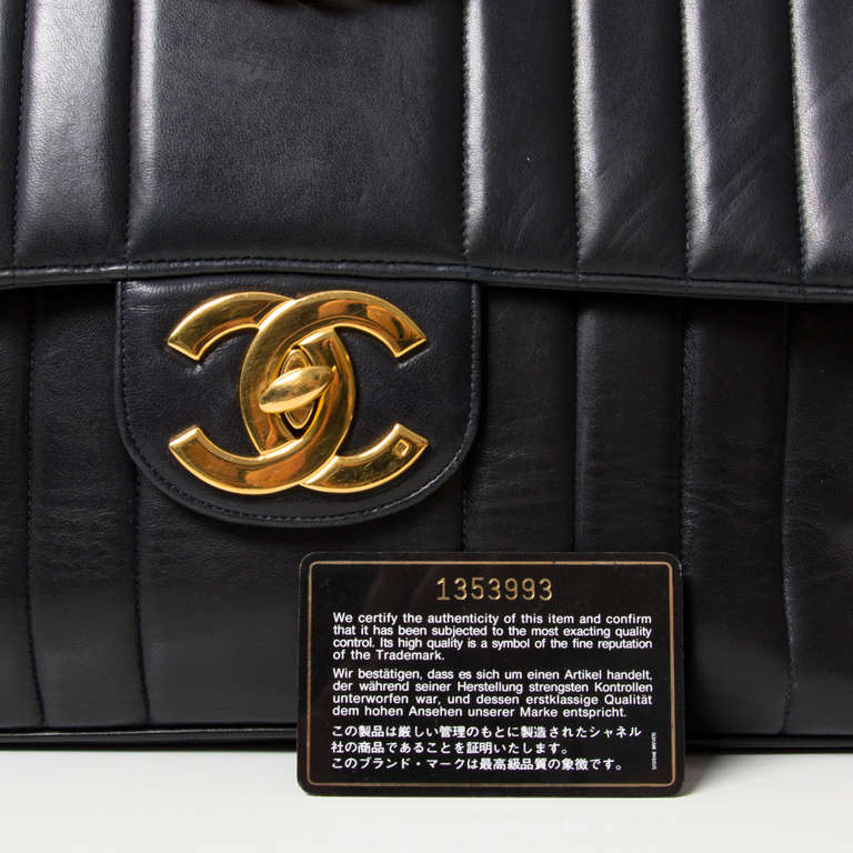 Gorgeous Chanel Jumbo Classic Flap Bag. 
Black lambskin and gold-tone hardware with signature double 'C' closure and chain strap. Burgundy lining. 

Comes with Chanel dustbag and authenticity card N° 1353993