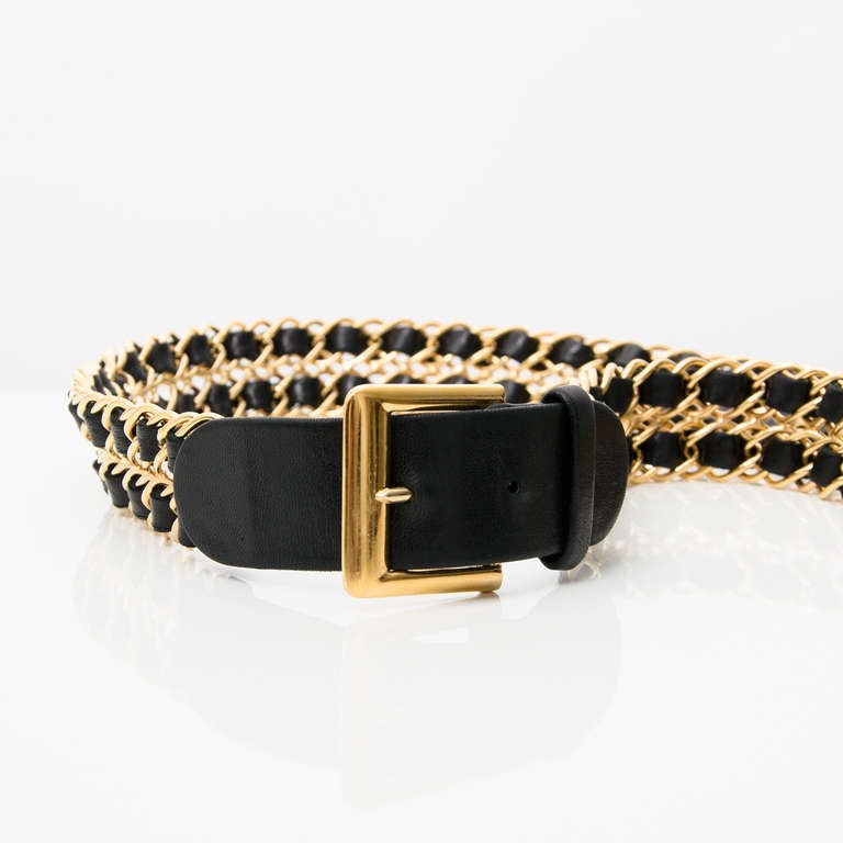Chanel gold chain and black leather belt. Double row. Two belt holes.

Comes with the original Chanel box.