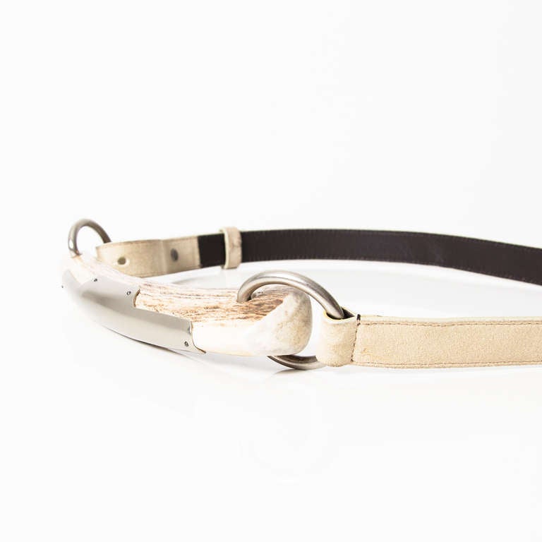 YSL Off-white Leather Mombassa Horn Belt. Features an antelope horn section with silver detailing and silver hardware links and hoops. 

At smallest: 83cm 
At widest 92cm