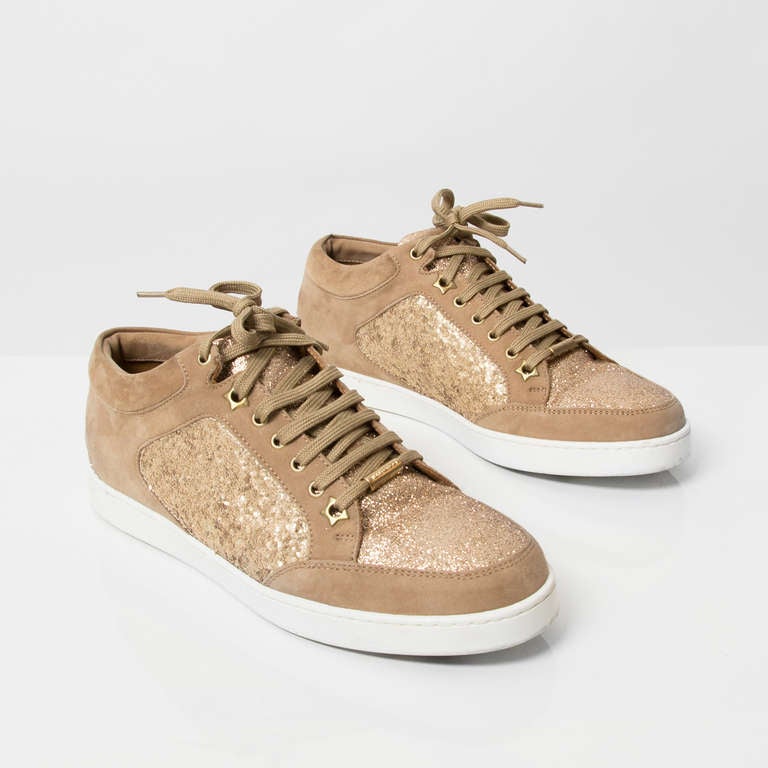 Jimmy Choo 'Miami' trainers made from beige suede. Color 'Sand'.  With gold glitter details.