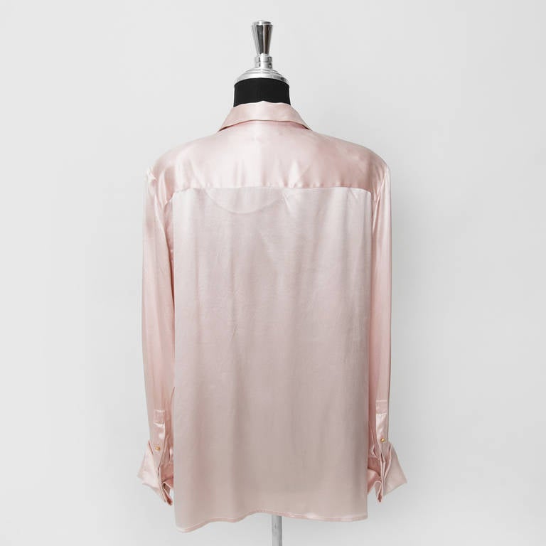 Chanel soft pink silk blouse. Matte gold buttons featuring the 