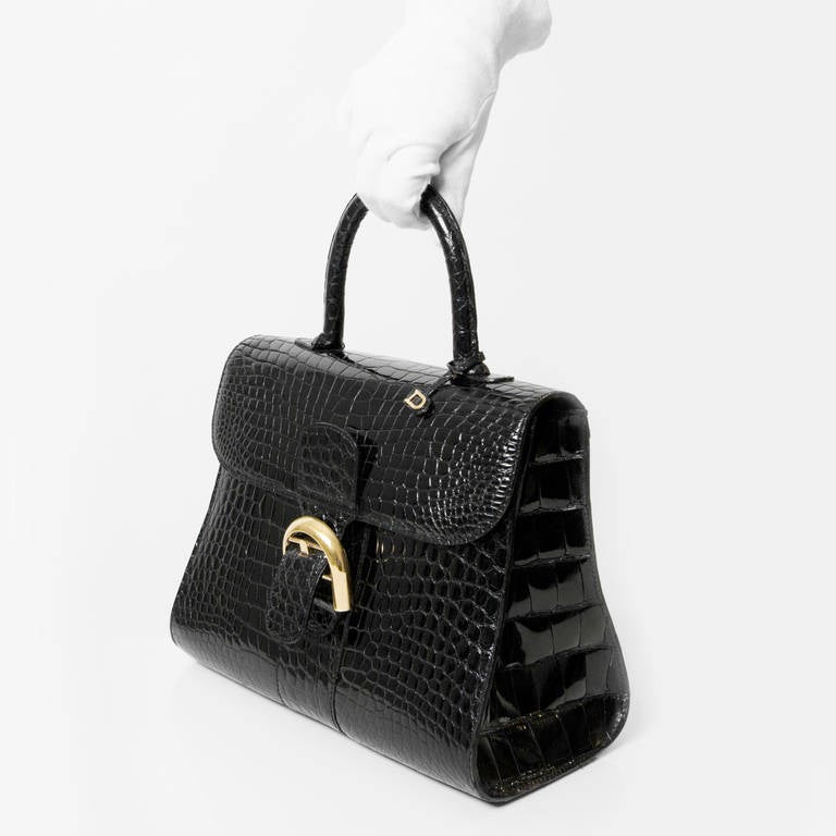 Sold at Auction: A Delvaux Brillant PM handbag in black Croco