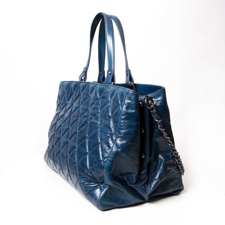 Chanel Portobello Petrol Blue Bag with chain shoulder strap. 
Inside, 3 Compartment Interior. 
Comes with authenticity card.