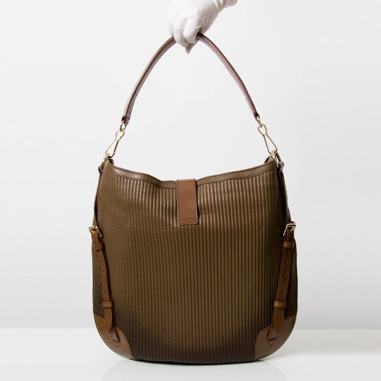 Brown ombre leather hobo bag with goldtone hardware by Burberry. A very cool relaxed chic style, with the colour of the leather degrading from dark brown to chocolate brown. In excellent condition. Comes with original dustbag.