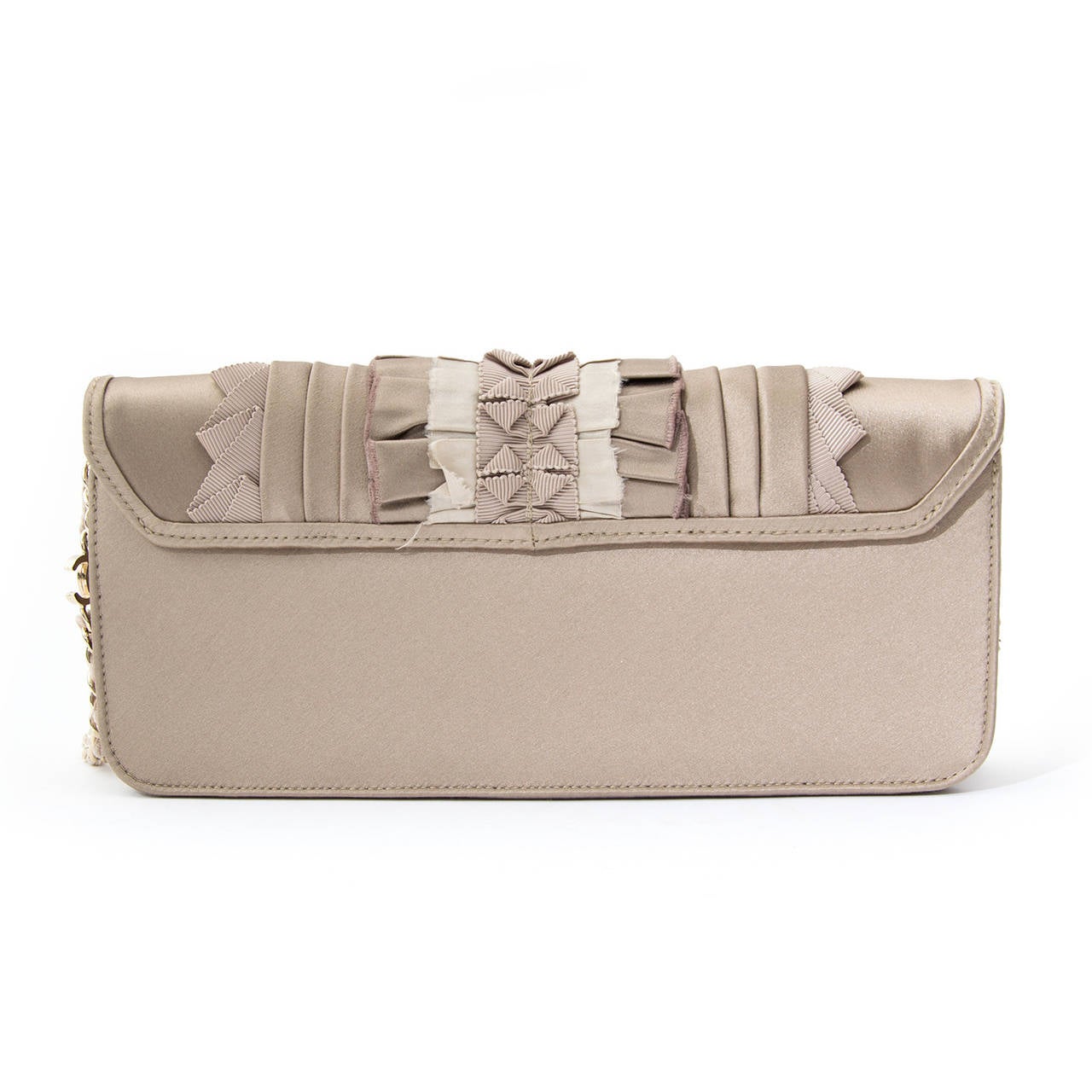 A gorgeous baguette shaped Chanel evening bag in beige and greige silks, with ruffle details. Hangs on a chain and velvet entwined strap to be carried on the shoulder or in hand like a clutch. With double C logo detail at the strap. 
Hologram