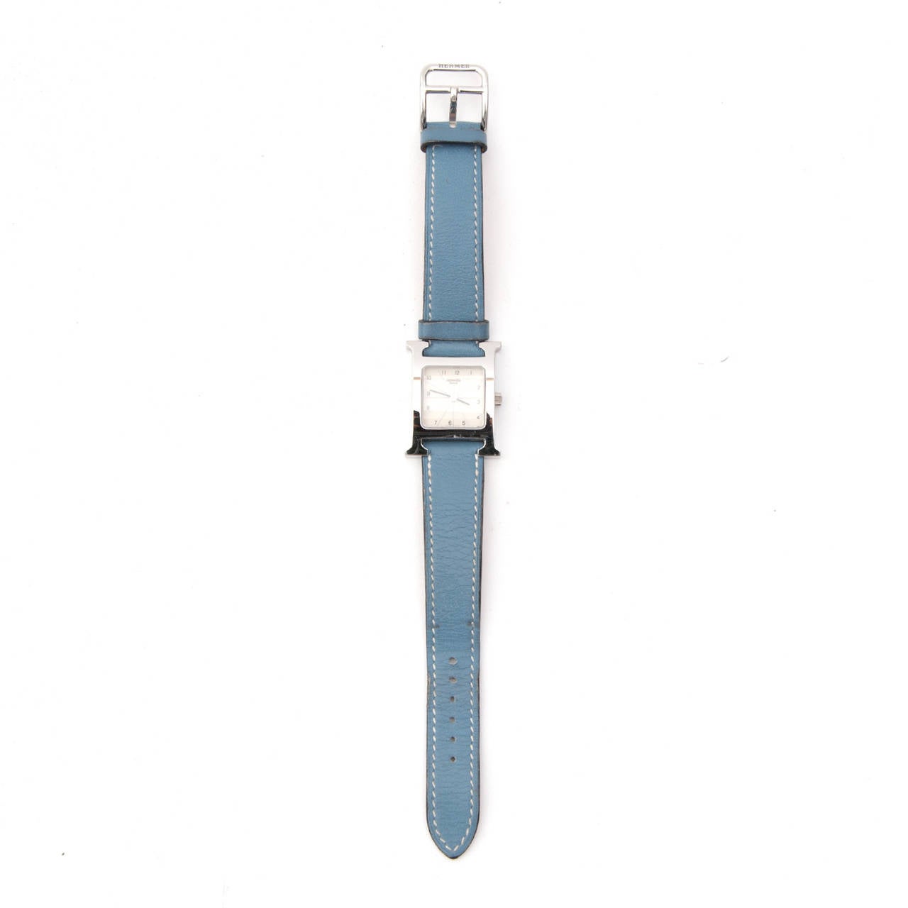 Lovely ladies watch: Hermes steel 'Heure H' watch with a white dial, quartz movement and smooth Blue Jean calfskin leather strap. Contrast stitching.
Comes in its oroginal box with international guarantee booklet and serial number.