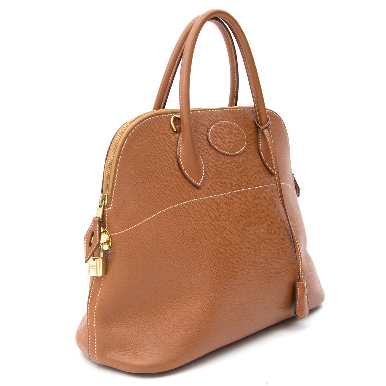 <p>The Hermès Bolide Gold is a real timeless classic bag, which unquestionably embodies femininity and class. The gold hardware adds a luxurious feel to this stunning piece. The interior features very smooth cognac colored lining and one open