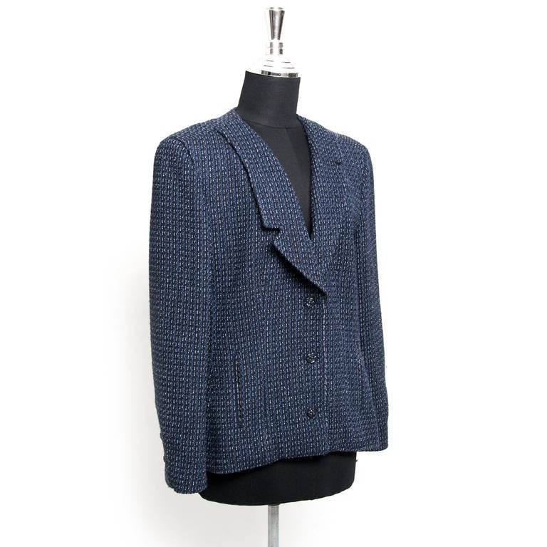 Chanel blue twee blazer.  Features a single breasted front with 3 flower buttons.