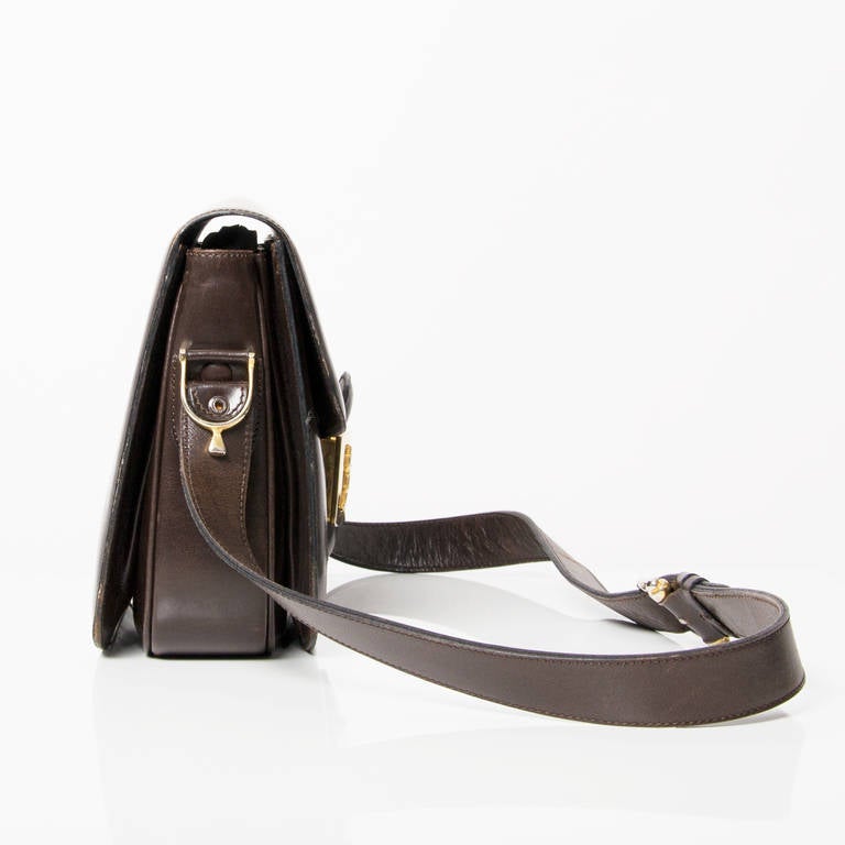 Celine Carriage buckle bag with golden hardware. 
Adjustable shoulder strap. Inside 3 separate compartments.