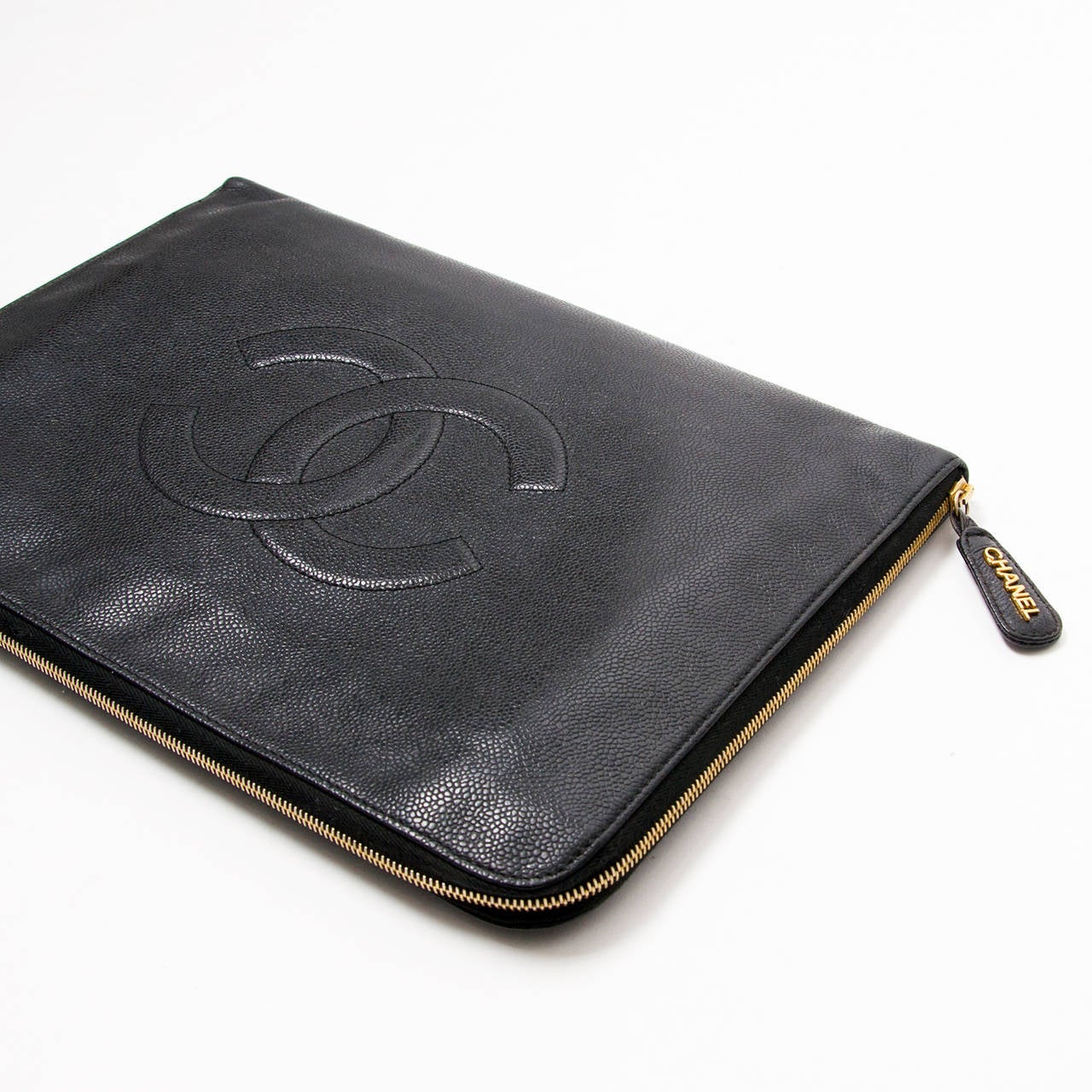 Chanel vintage black caviar briefcase clutch with golden hardware. 
Golden zipper closure. Inside 2 compartments.