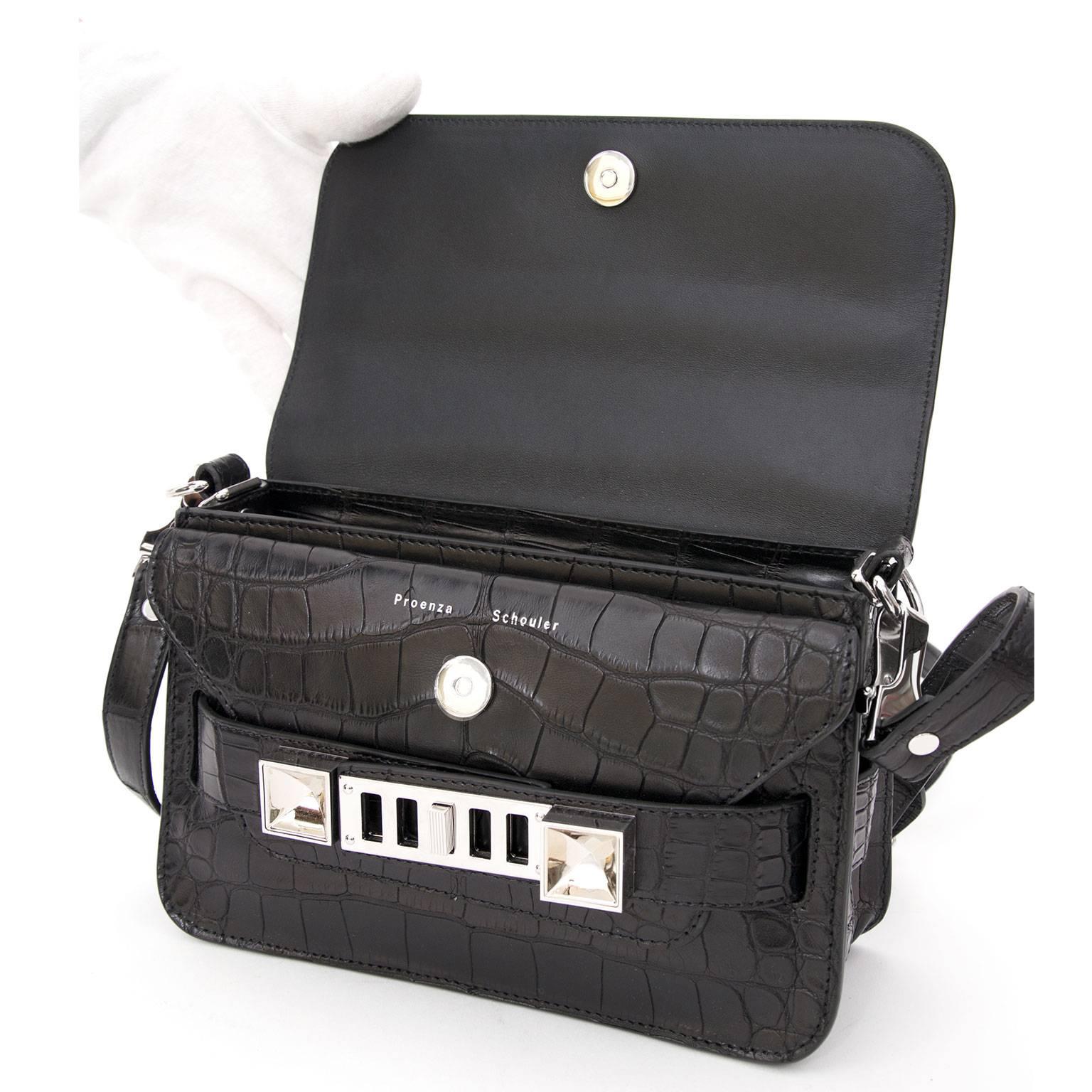 Manhattan-based design duo Proenza Schouler have lit up the fashion scene with their super covetable creations, and their 'PS11' shoulder bag is seriously hot property. We adore this rare black Crocodile leather version finished with silver and pale