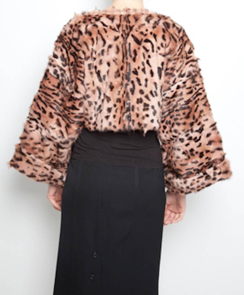 Every wardrobe needs an animal-print fur jacket and this Roberto Cavalli stola is the excellent alternative. The three-quarter sleeves are perfect for showing off your favorite bracelets. 
Wear it on black (leather) pants or on a lovely dress to